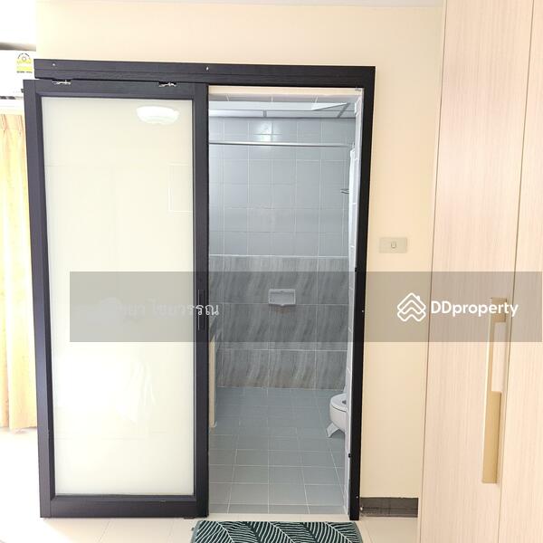 Bathroom with sliding door for easier access.