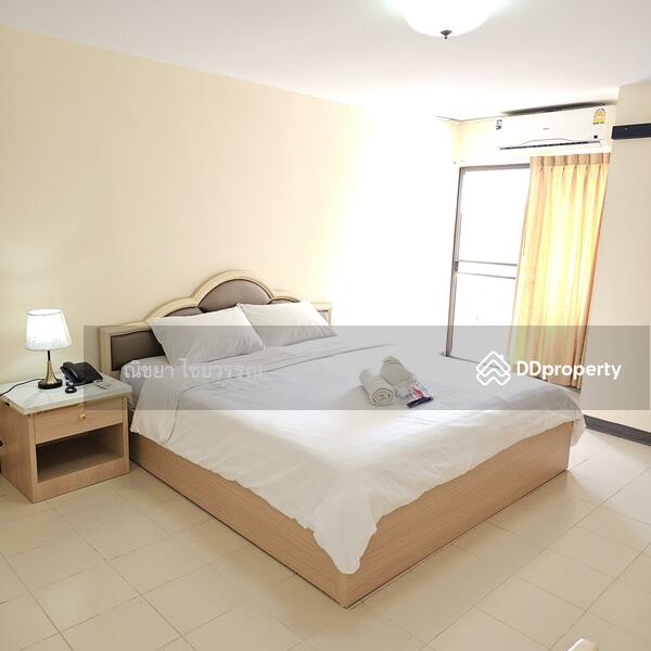 One bedroom with access to the balcony.