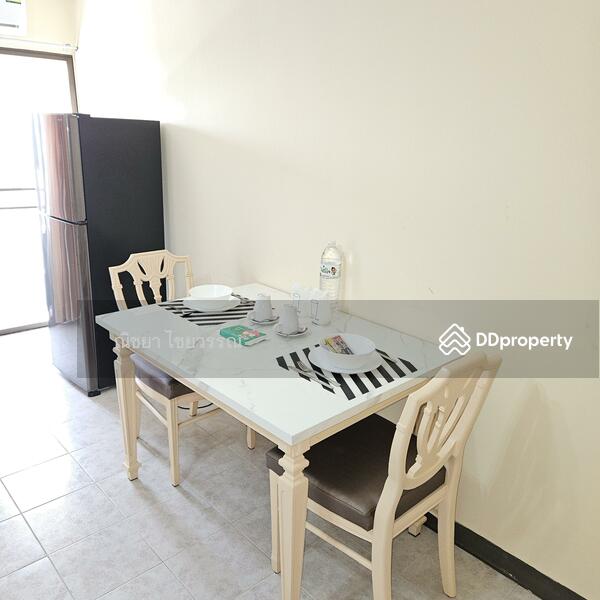 Dinning Area with large refrigerator.