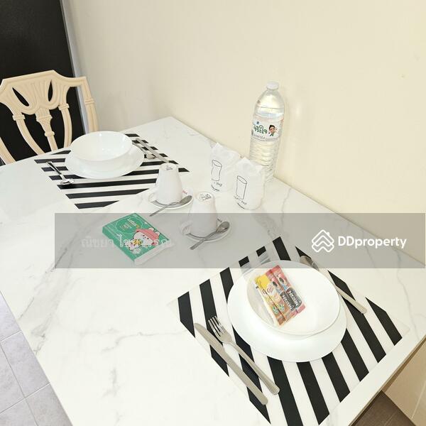 Dinning table with fully equipped utensils.