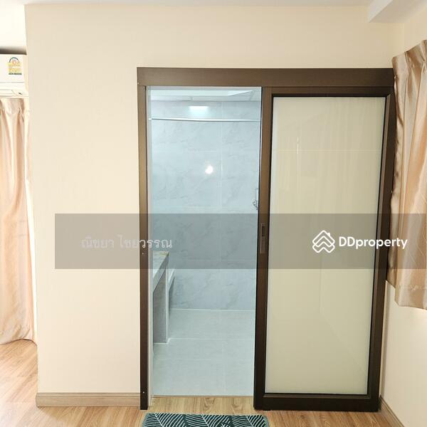 Ensuite bathroom with sliding door for easier access.