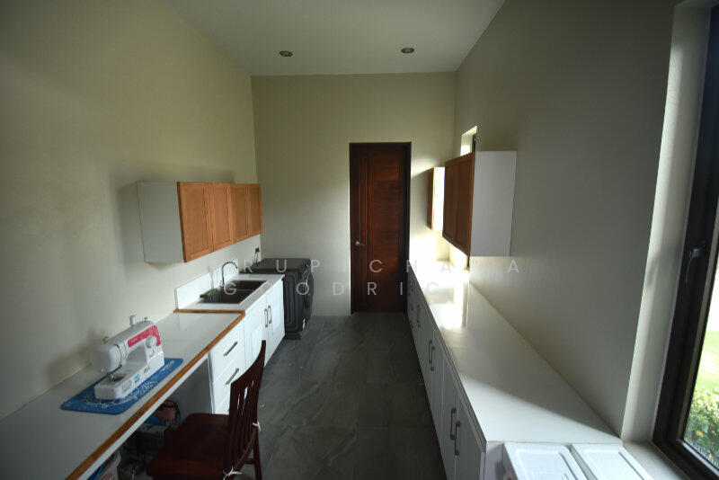 Laundry room with door to garage
