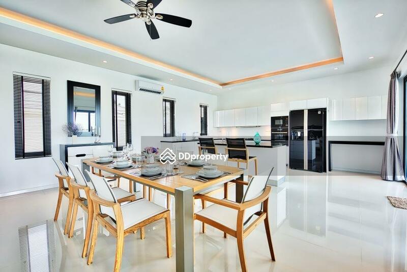 Dining area next to kitchen section