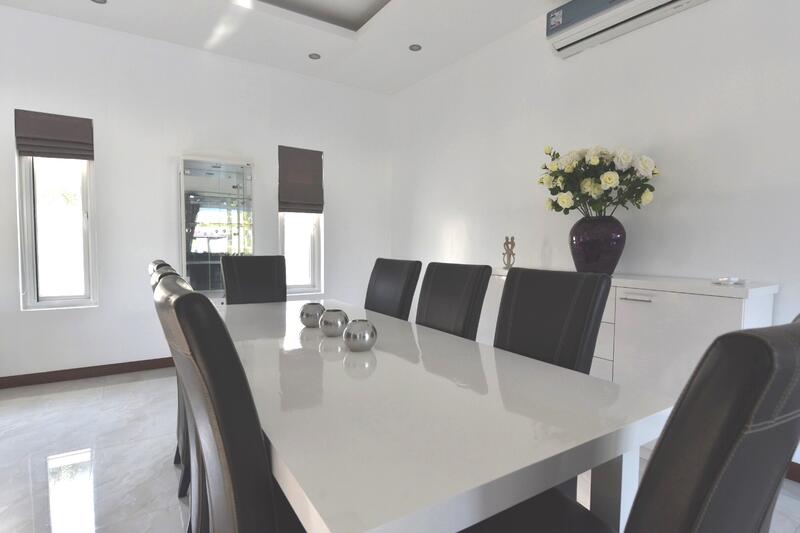 Dining area next to closed kitchen